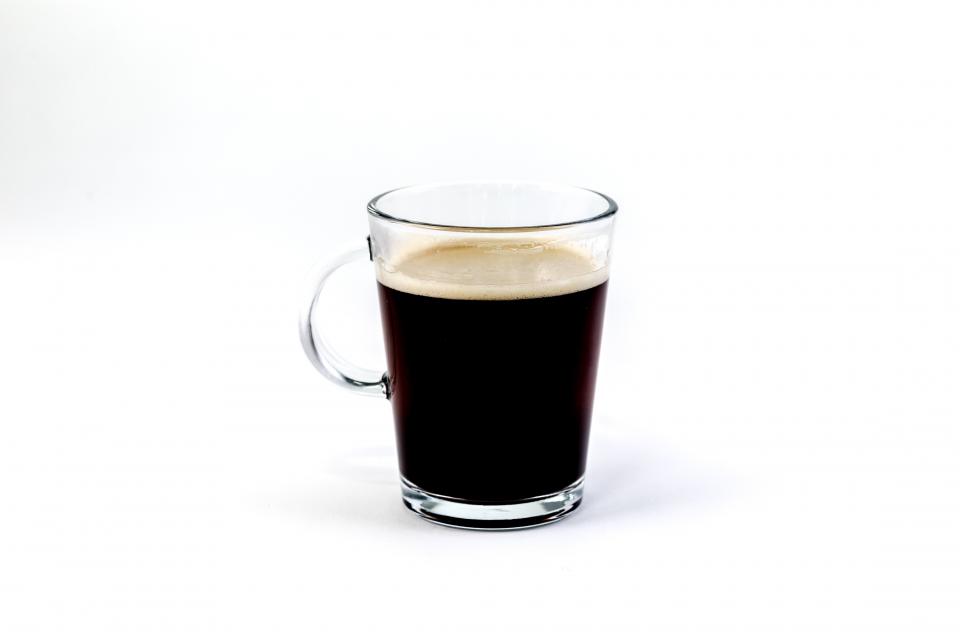 A glass of freshly brewed black coffee